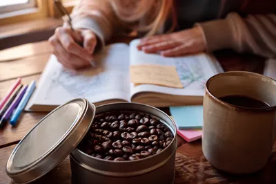 Teen Bible Journaling in Cozy Coffee Shop