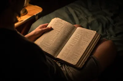 Teen Reading Bible in Quiet Bedroom