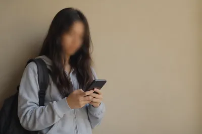 Teen Student Checking Phone With Copy Space