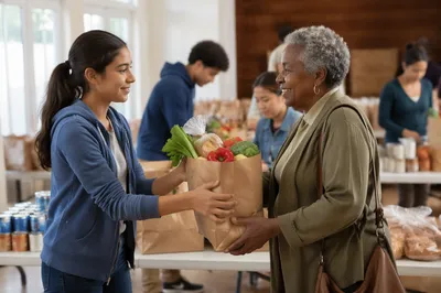 Teen Volunteer Giving Groceries to Senior