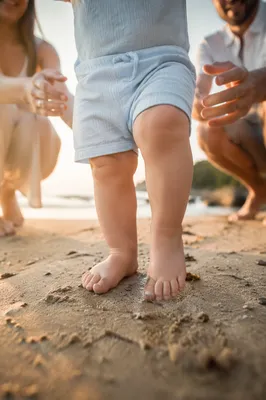 Toddler First Steps on Sandy Beach