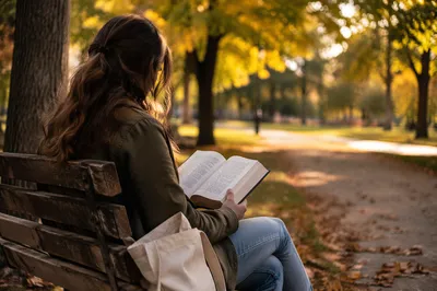 Young Adult Reading Bible on Park Bench