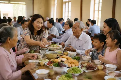 Vietnamese Families Sharing Meal in Community Hall