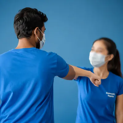 Community Volunteer Team in Matching Blue Shirts