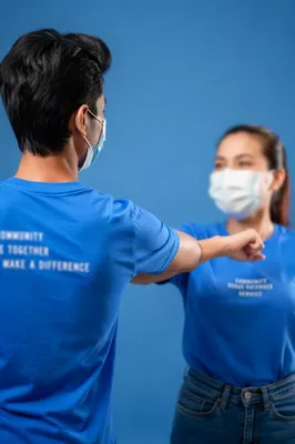 Community Volunteers in Matching Blue Shirts