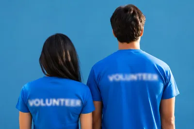 Community Volunteers in Matching Blue Shirts