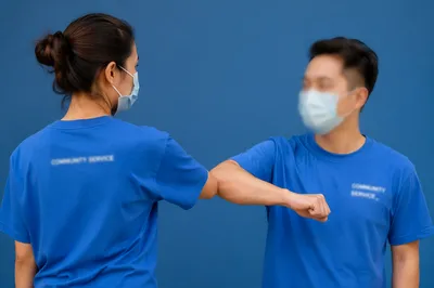 Community Volunteers in Matching Blue Shirts