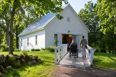 Wheelchair User Approaching Rural Chapel Entrance