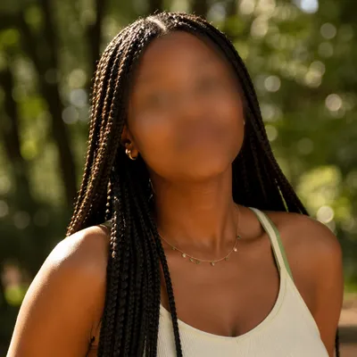 Confident Woman Portrait in Sunlit Park
