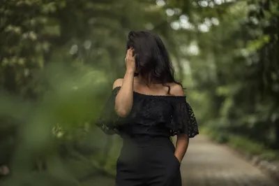 Confident Woman on Serene Green Path