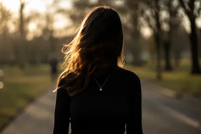 Confident Woman on Warm Park Path