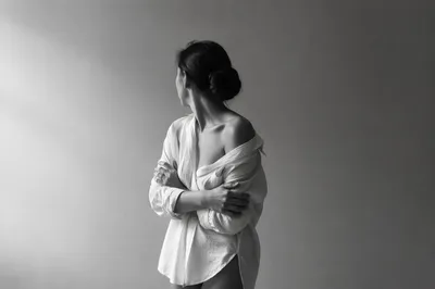 Confident Woman Portrait in Soft Gray Studio
