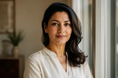 Confident South Asian Woman by Window