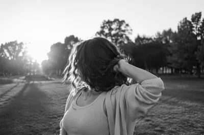 Confident Woman Portrait in Evening Park