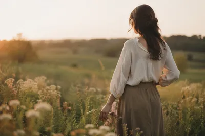 Confident Woman in Golden Meadow Light