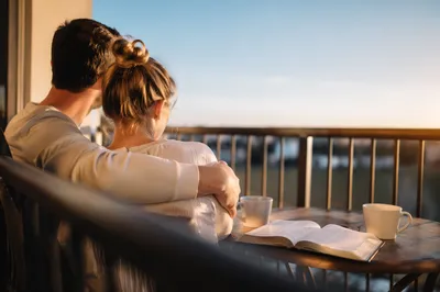 Couple Reading Bible on Morning Balcony