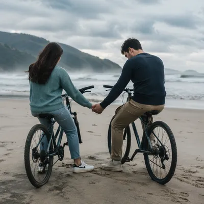 Young Couple Praying on Beach Bicycles