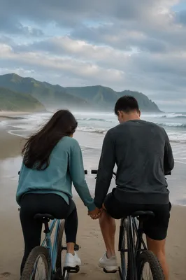 Young Couple Praying on Beach Bicycles