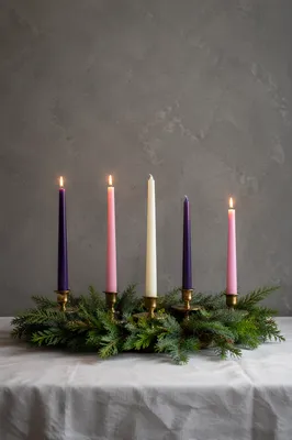 Warm Advent Candles in Evergreen Wreath