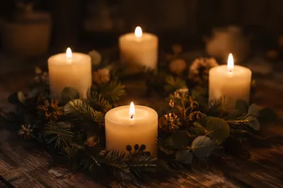 Warm Advent Candle Wreath on Rustic Table