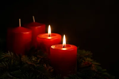 Warm Advent Candles in Evergreen Wreath
