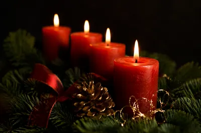 Warm Advent Candles in Evergreen Wreath