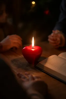 Heart Shaped Candle by Open Book