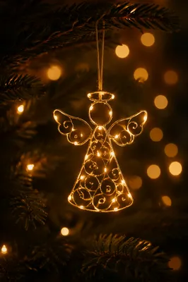 Glowing Angel Ornament on Christmas Tree