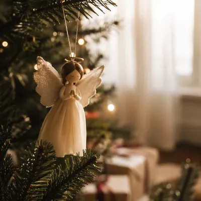 Angel Ornament on Christmas Tree Branch