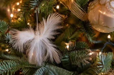 White Angel Ornament in Christmas Tree Lights