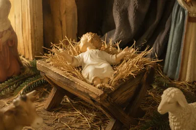 Baby Jesus Resting in Rustic Manger