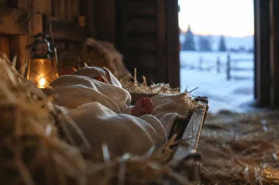 Baby Jesus Resting in Straw Manger