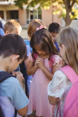Children Praying Together Before School