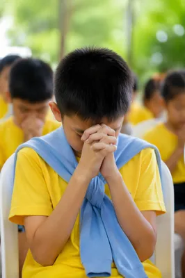 Children Praying Before School Outdoors