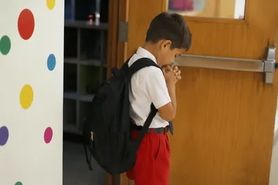 Child Praying Before First Day of School