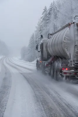 Blizzard Covered Rural Highway With Tanker Truck