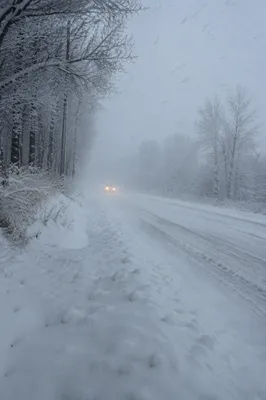 Blizzard Covered Rural Winter Road Scene