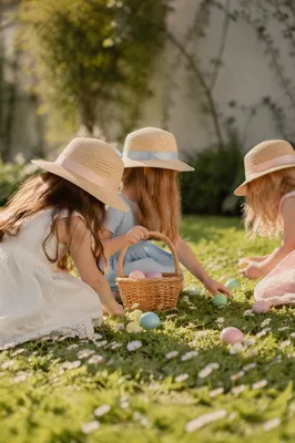Children Easter Egg Hunt on Sunny Grass