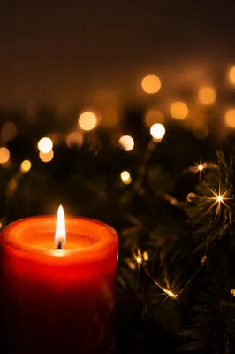 Warm Christmas Candle with Festive Bokeh