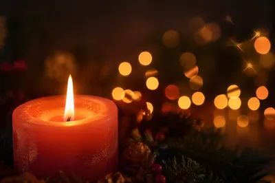 Warm Christmas Candle with Golden Bokeh