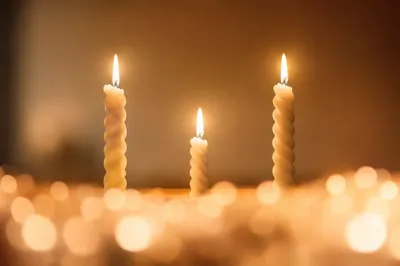 Warm Christmas Candlelight with Golden Bokeh