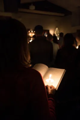 Candlelight Congregation in Chapel Interior