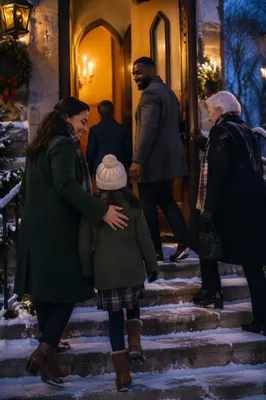 Family Entering Church on Winter Evening