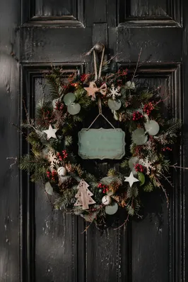 Rustic Christmas Wreath on Weathered Wooden Door