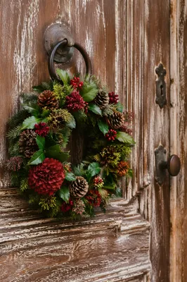 Christmas Wreath on Weathered Wooden Door