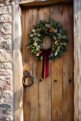 Christmas Wreath on Rustic Wooden Door