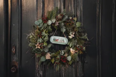 Handmade Christmas Wreath on Weathered Wooden Door