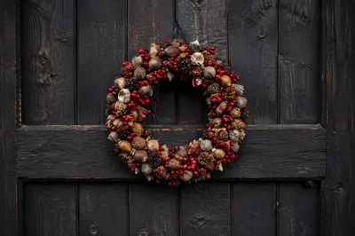 Rustic Christmas Wreath on Weathered Wooden Door