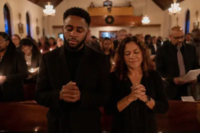 Congregation Praying in Church at Midnight