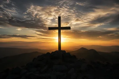 Easter Cross Sunrise Over Rugged Mountain Ridge
